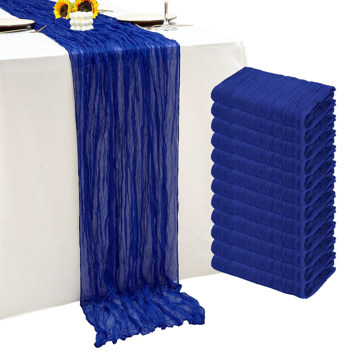 Seveups royal blue cheesecloth table runner gracefully draped for a wedding banquet.