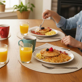 SHACOS placemats on a dining setup with hot dishes suggesting heat resistance