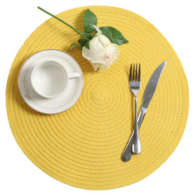 SHACOS round placemats in yellow dress up every dining occasion.