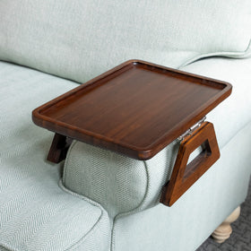 Shamrock Home Trayble on a couch arm showing stable bamboo construction and wide arm fit