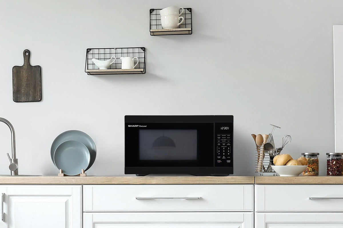 Sharp 1000W auto cook menu button guides reheating for common items.