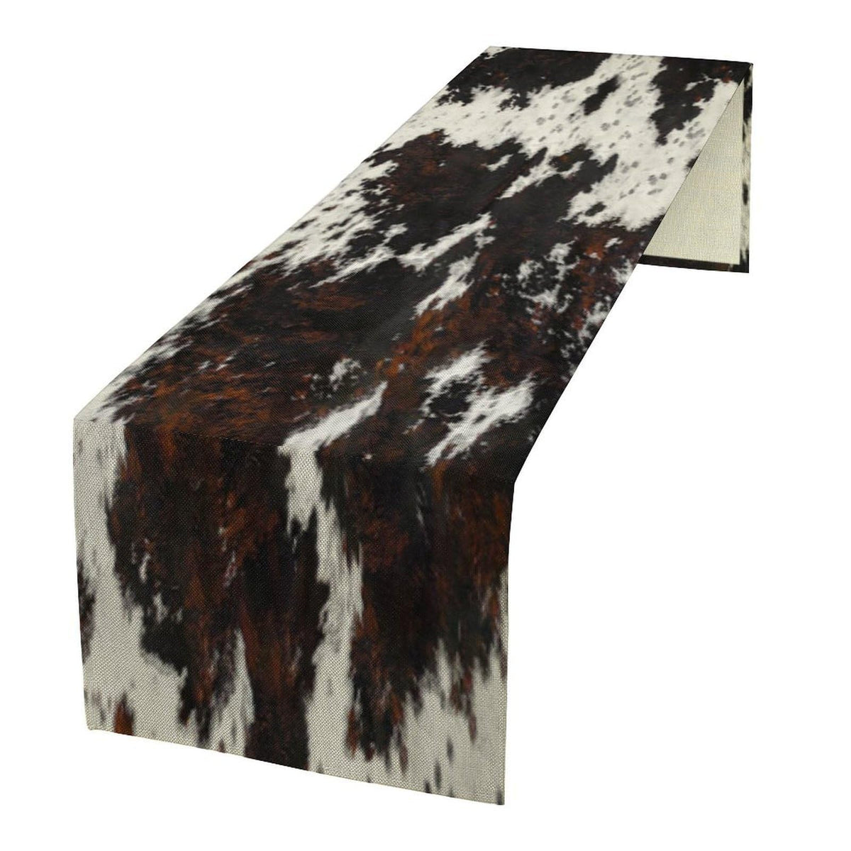 SHElifestyle cow skin print table runner adds rustic charm while protecting tabletops.
