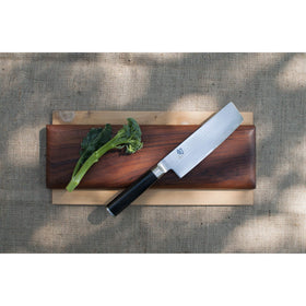 Shun Classic Nakiri knife handle with D-shaped PakkaWood grip.