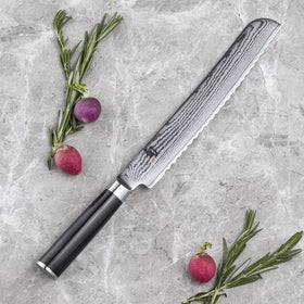 Shun Classic Damascus-clad blade reduces sticking for smooth pastry cuts.