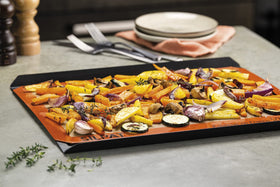 Silpat baking mat in oven demonstrates parchment substitute in action.