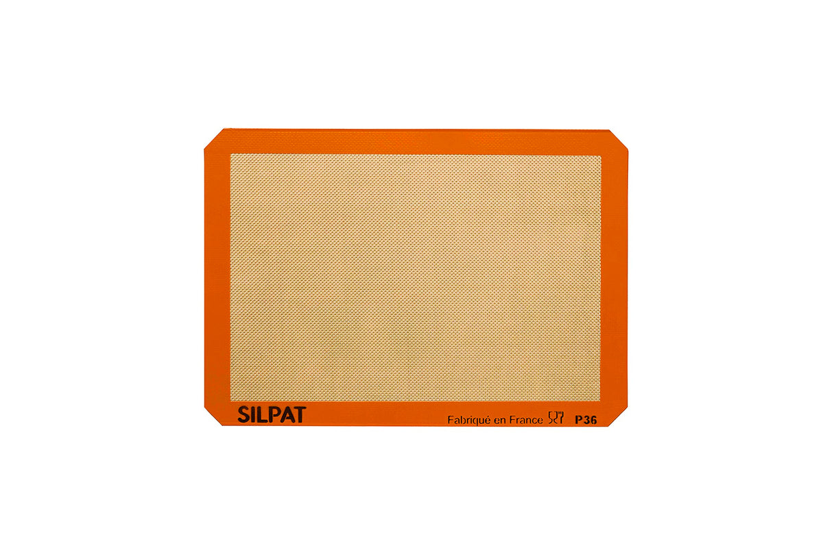 Silpat premium non-stick baking mat on counter for easy cleanup.