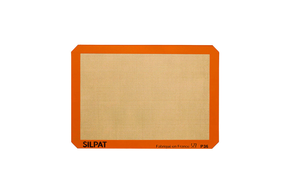 Silpat premium non-stick baking mat on counter for easy cleanup.