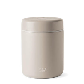 Simple Modern Delta coffee canister demonstrating vacuum-seal action for freshness.