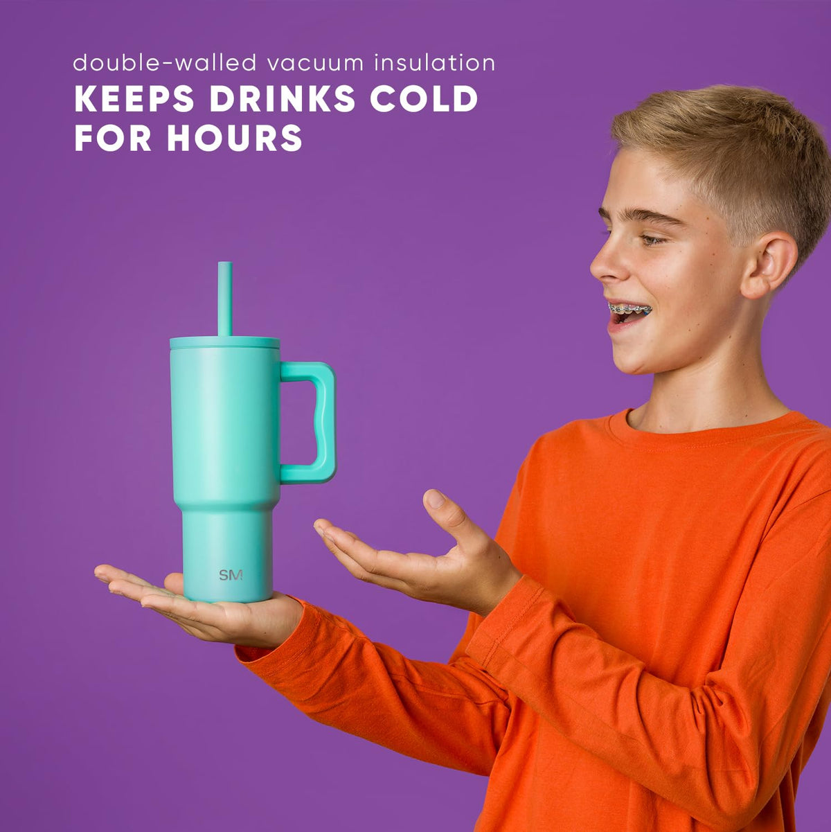 Kid holding the Simple Modern Kids Trek tumbler during outdoor activity.