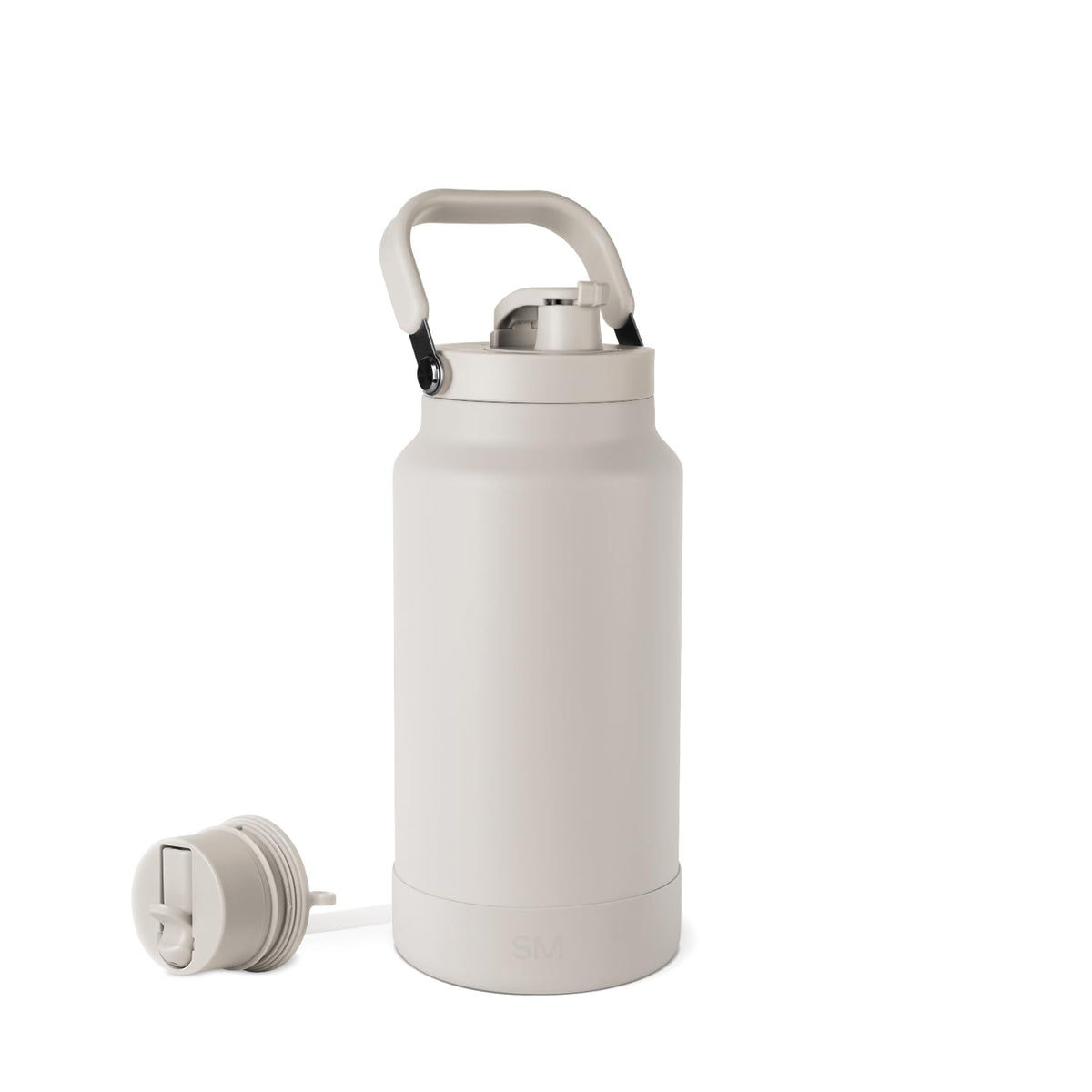 Simple Modern Trek Pivot 64oz bottle almond birch with handle for long road trips.