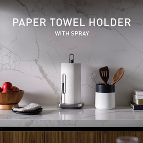 simplehuman standing paper towel holder with spray pump, side view, convenient reach during busy tasks.