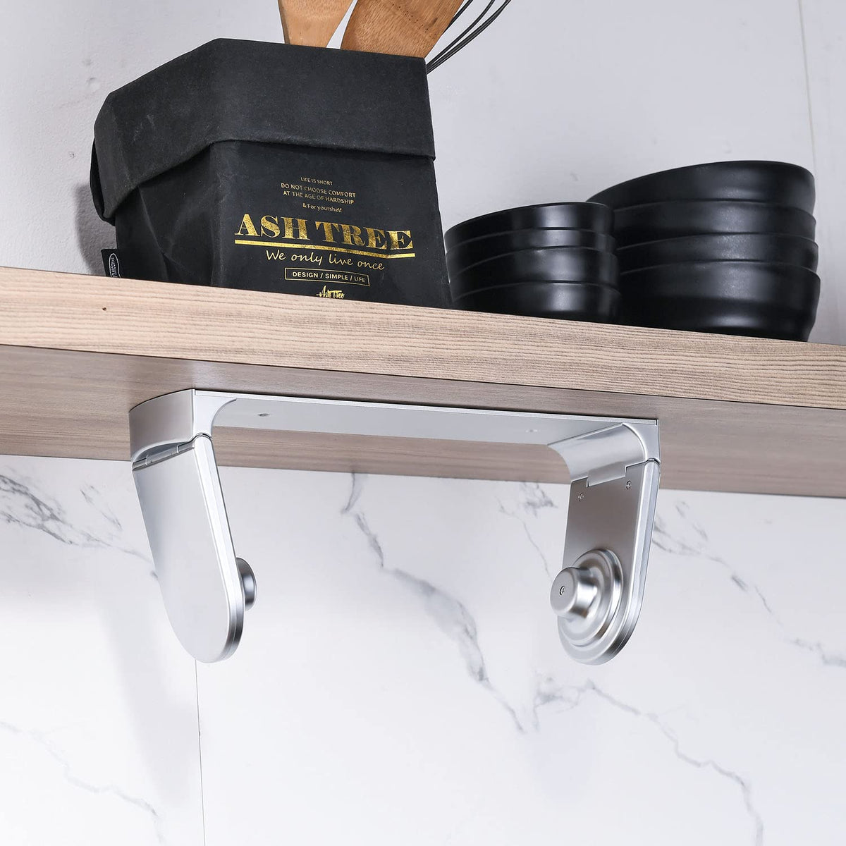 Simpletome kitchen setup shows convenient towel access during cooking.