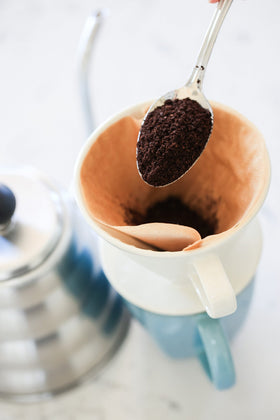 Simply Charmed dripper on counter—elegant coffee bar accent.