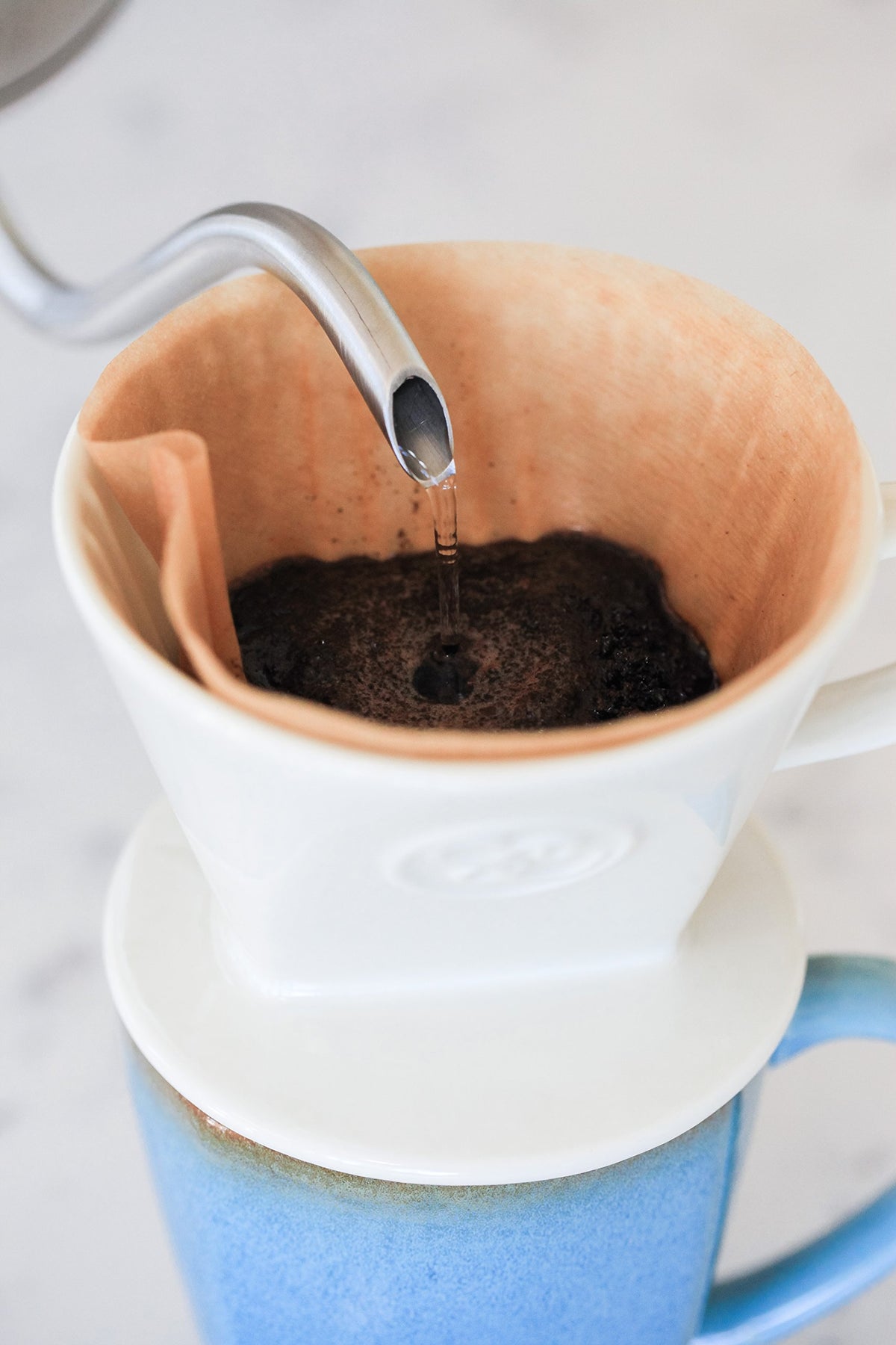 Simply Charmed pour-over base measures 4 inches by 3 inches—compact fit.