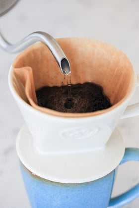 Simply Charmed pour-over base measures 4 inches by 3 inches—compact fit.
