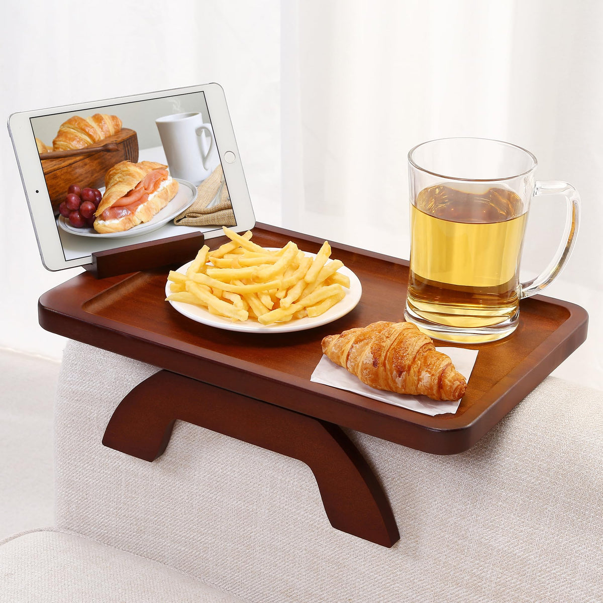SINWANT bamboo arm tray clipped onto a sofa arm for drinks within reach.