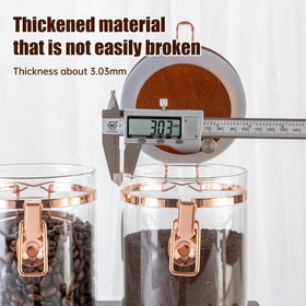 Clear glass jars neatly organize coffee and pantry staples in style.