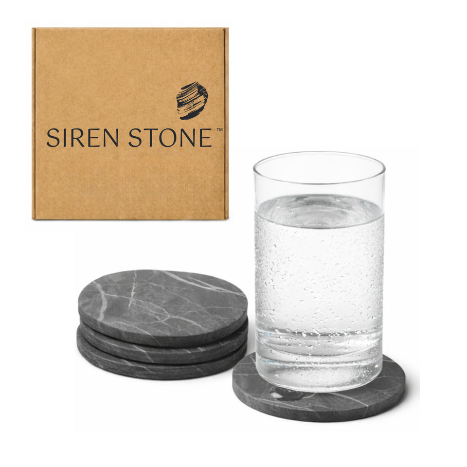 Siren Stone coasters 4-pack laid out on table, slate texture protects surfaces.