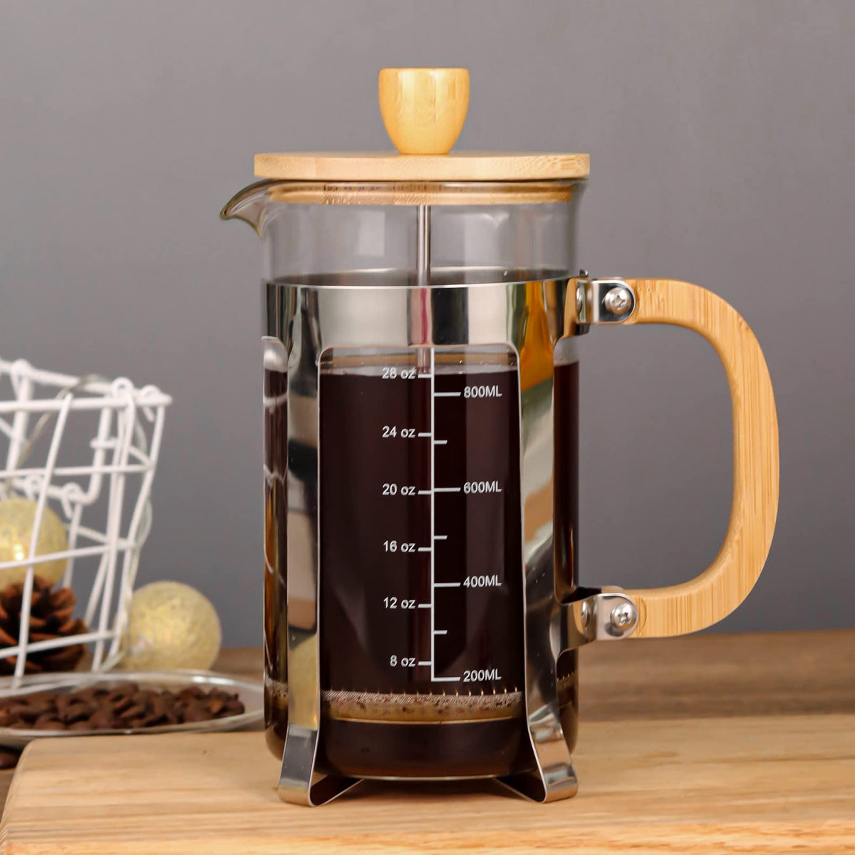 Sivaphe glass carafe in a stainless steel frame on a kitchen counter