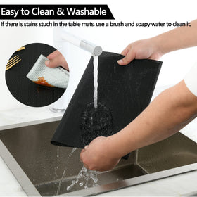 SLKQG black placemats closeup, clear heat resistance and durable vinyl for everyday meals.