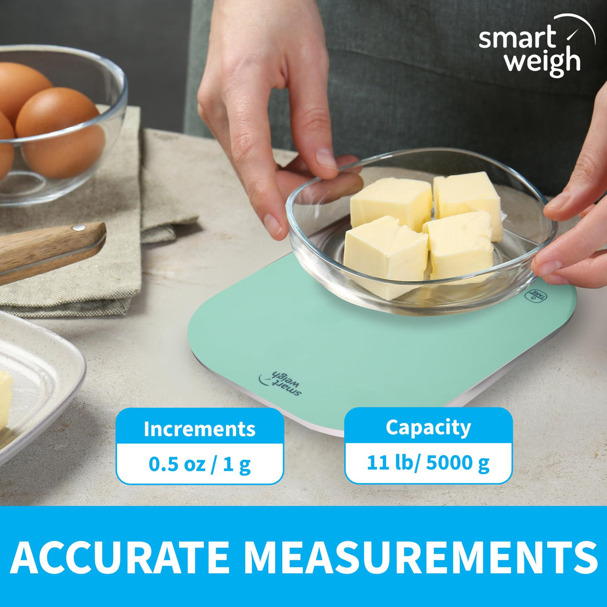 Smart Weigh mint green scale on a countertop with compact storage features.