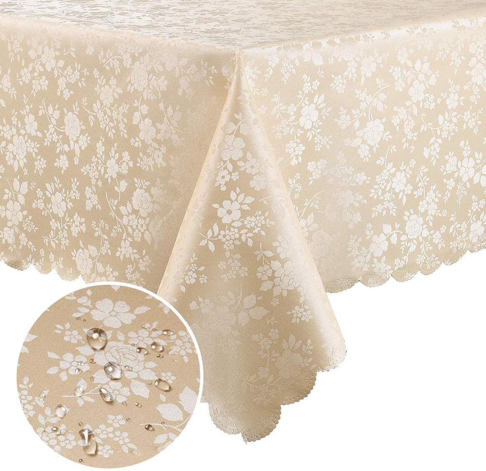 Smiry floral embossed tablecloth in beige with scalloped edges enhances dining ambiance