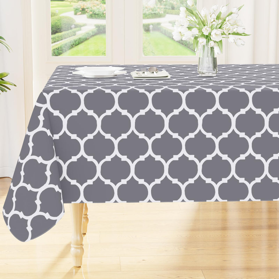 Smiry rectangle table cloth on grey dining table, protects against spills.