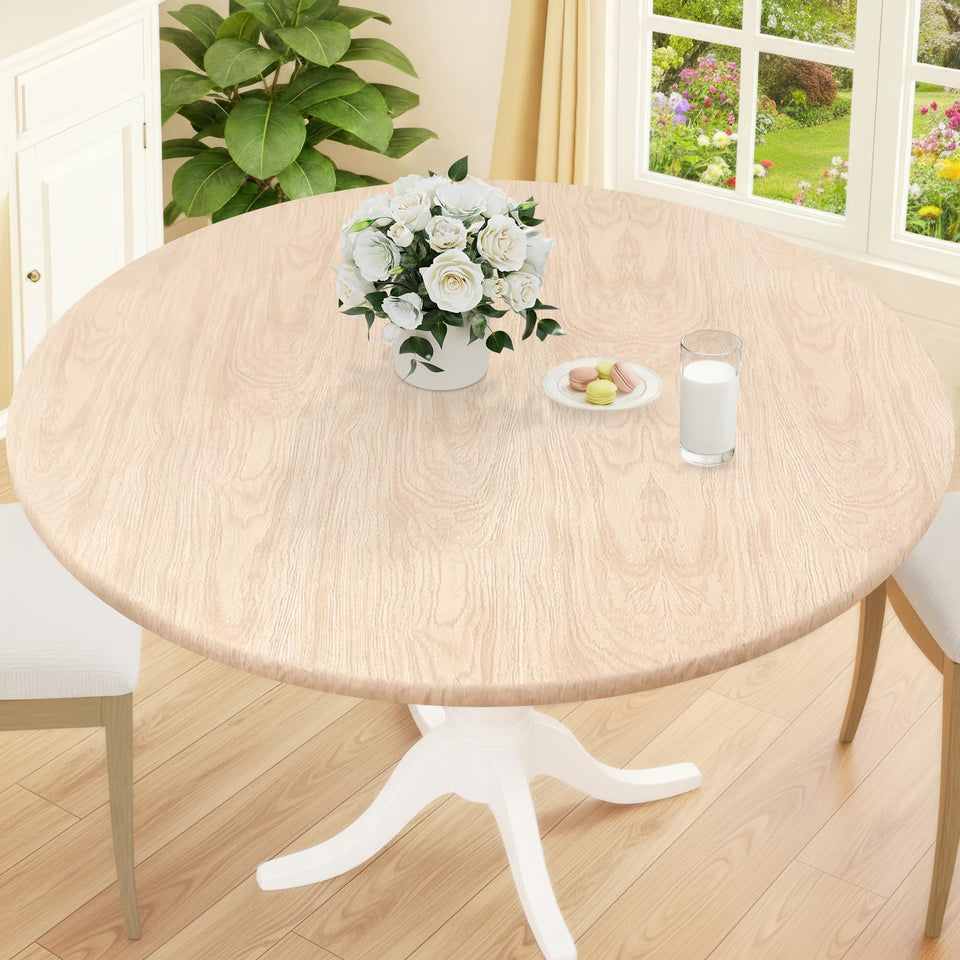 Smiry elastic-edge round tablecloth secures a snug fit on 68x57 inch tables.