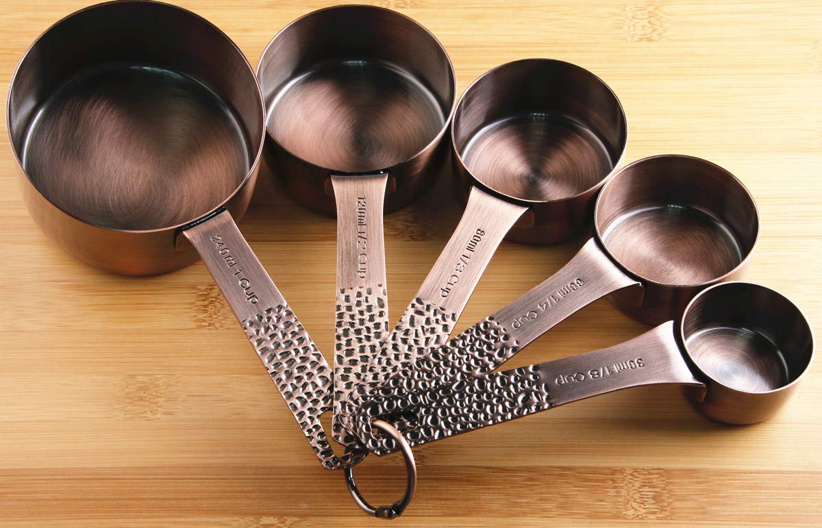 Smithcraft 13-piece set includes five cups and six spoons for versatile cooking.