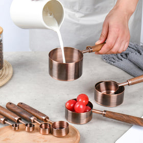 Smithcraft copper measuring spoon 1tsp 5ml with wood handle for precise seasoning.