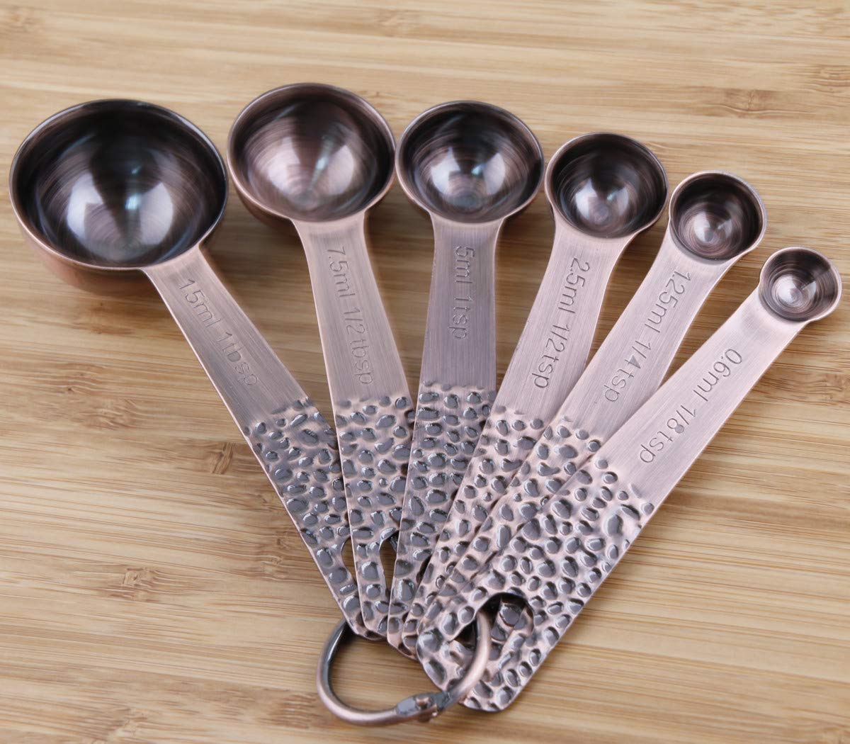 Smithcraft locking rings securing cups and spoons for easy storage.