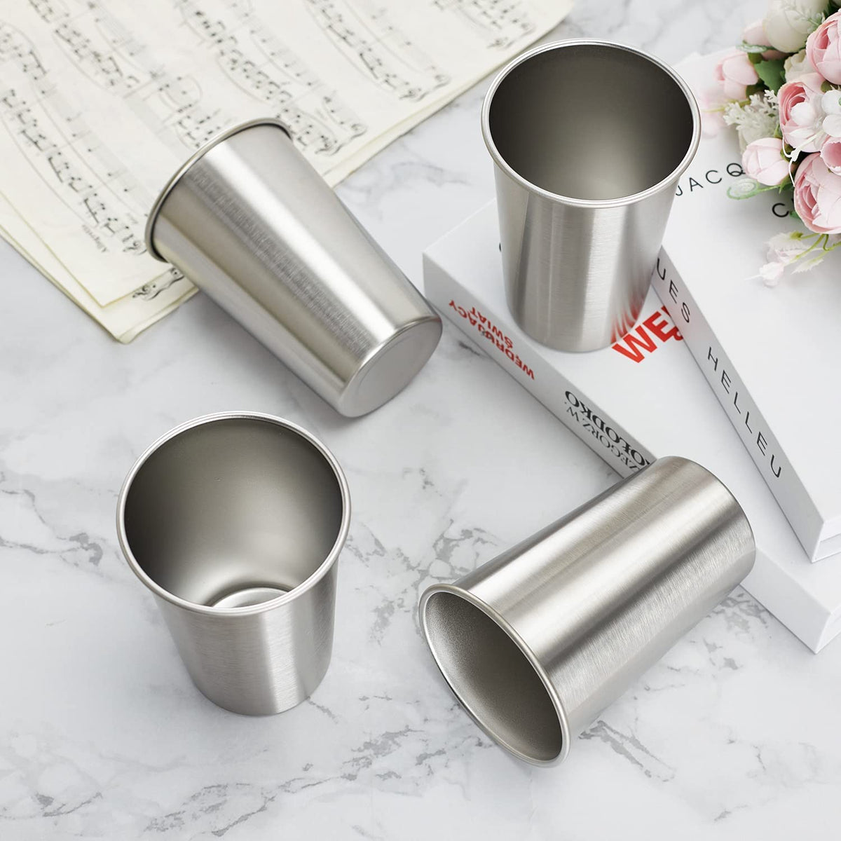SMLIXE four-pack 24oz pint cups, in hand, comfortable grip.
