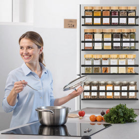 SMRCAD rack mounted on metal surface holding multiple spice bottles securely.