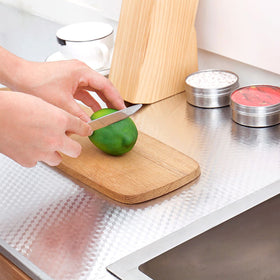 Snkxu self-adhesive PVC backsplash installation demonstrates glue-free setup.