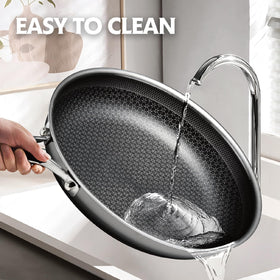 SNOWCLAD pan with vegetables sizzling illustrates quick, uniform searing.