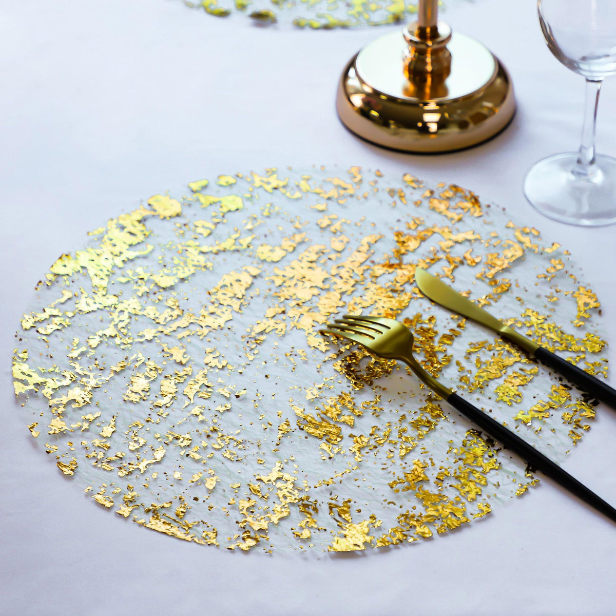 Snowkingdom foil mesh gold design placemats add sparkle to party decor.