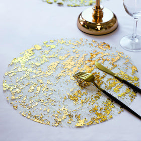 Snowkingdom foil mesh gold design placemats add sparkle to party decor.