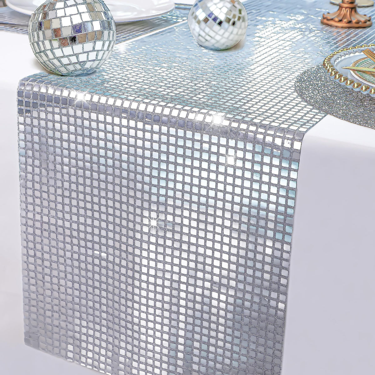 Snowkingdom glitter mirror silver runner reflecting party lights on a dining table