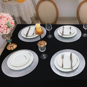 Snowkingdom pressed vinyl placemats in silver add subtle shine without staining.