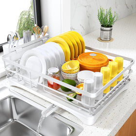 SNTD dish drying rack on counter with large capacity for quick air drying of dishes.