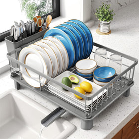 SNTD dish drying rack with angled drainboard directing water to the sink, reducing countertop moisture