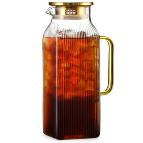 Snuvid square pitcher with stripes and gold lid, ideal for stylishly serving iced tea.
