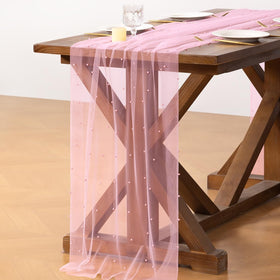 Socomi pink table runner complements Christmas and Easter tables with soft drape.