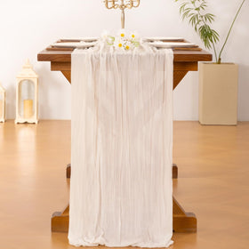Socomi ivory cheesecloth runner set up for a baby shower table décor.