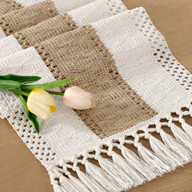 Socomi boho table runner with macrame fringe enhances rustic dining ambiance.