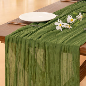 Socomi campsite green cheesecloth table runner on a rustic wooden table for elegant dining