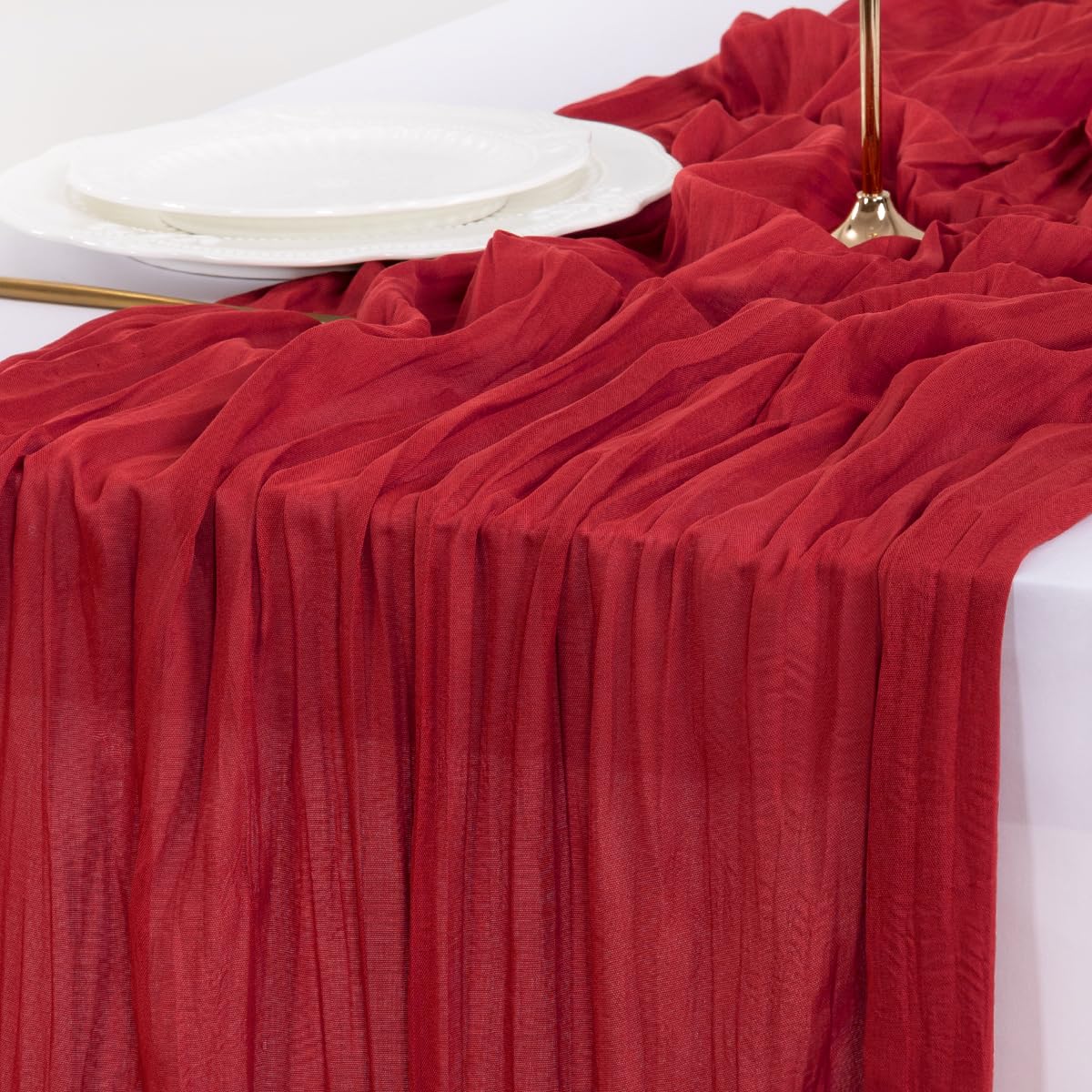 Socomi cheesecloth runner in a dining setup with soft drape.
