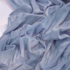 Socomi cheesecloth runner with edge stitching enhances durability and a graceful drape.
