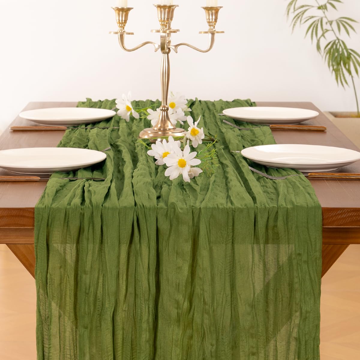 Socomi green cheesecloth table runner styled for baby shower decor