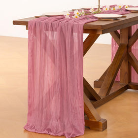 Socomi mauve cheesecloth runner used in a baby shower decor for charm.